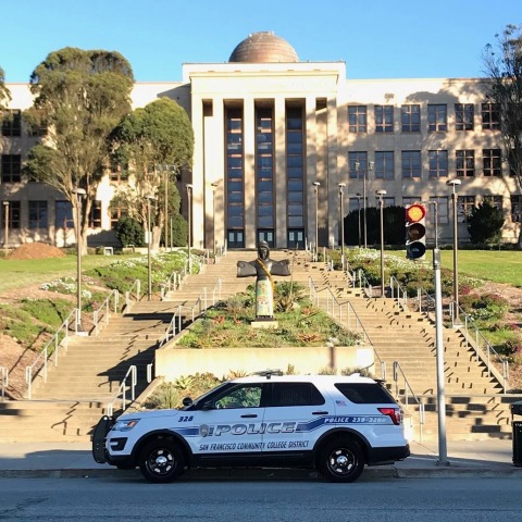 Police vehicle in front of ſ Science Hall